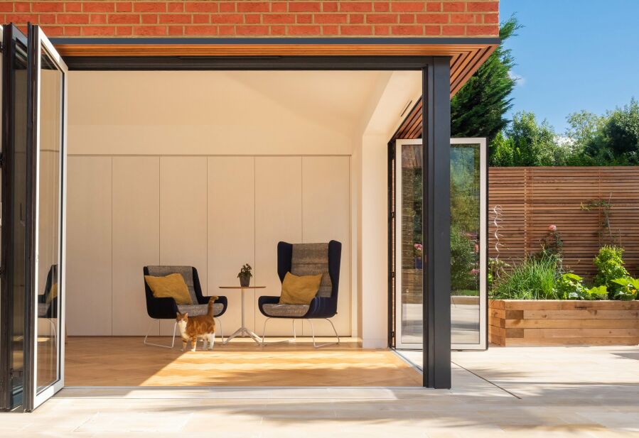 Modern extension with corner sliding folding glazed doors..