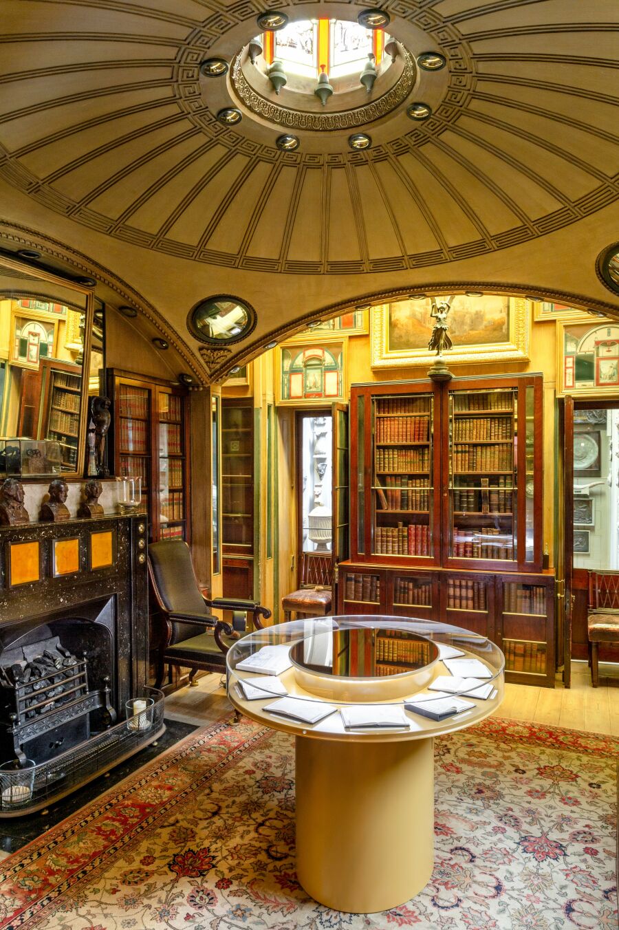 Library room with a circular perspex display cabinet..