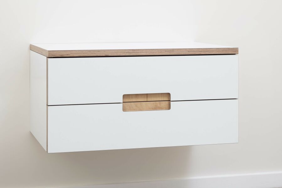 Laminated birch plywood floating bedside table with routed finger pull handle detail..